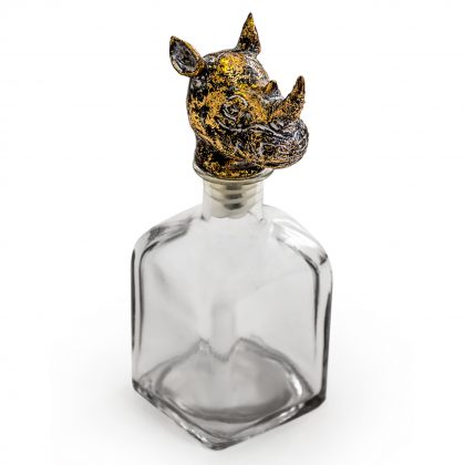 Rhino head glass bottle with stopper is a stylish and unusual ornament. The rhino head is an attractive stopper to the square glass bottle. 24 x 10 x 10cm