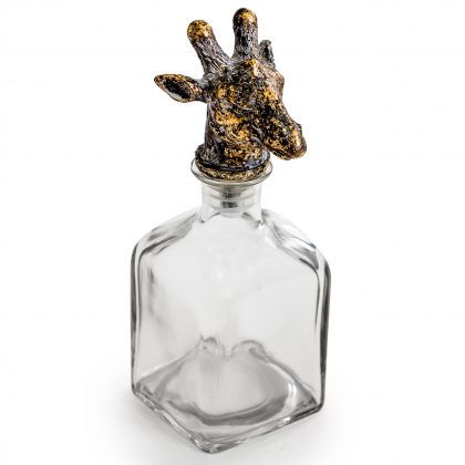 This giraffe glass bottle is a quirky and unusual ornament. The small giraffe head provides an attractive stopper to a square glass bottle. 24 x 10 x 10cm